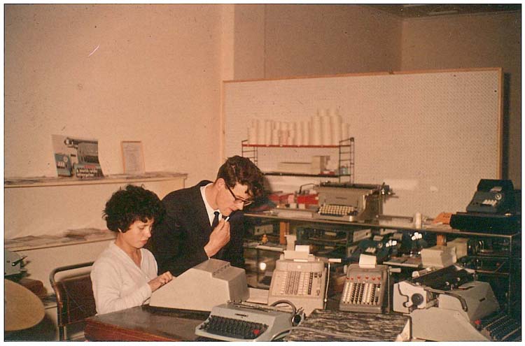 eManaged Historical Photo of two people working